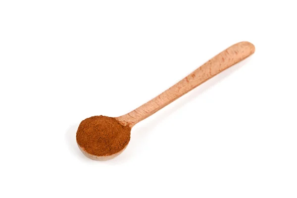 Cannella macinata in cucchiaio di legno — Foto Stock