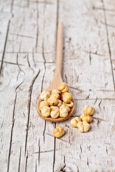 Hazelnuts in wooden spoon — Stock Photo, Image
