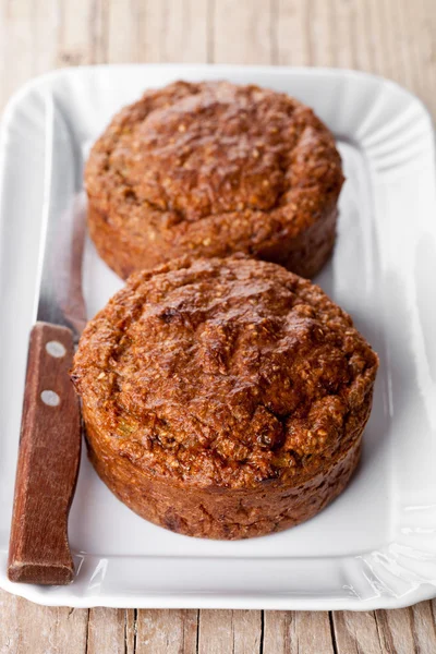 Fresh buns and old knife — Stock Photo, Image