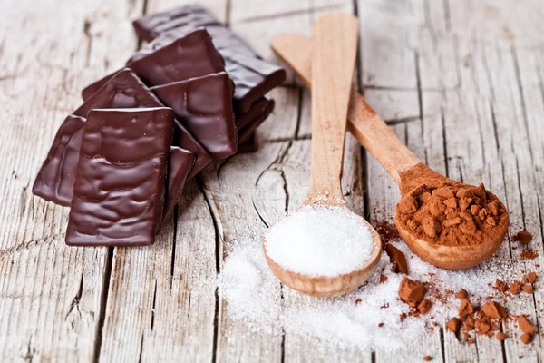 Dulces de chocolate, cacao en polvo y azúcar — Foto de Stock