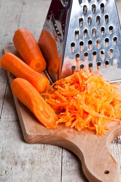 Metal grater and carrot — Stock Photo, Image