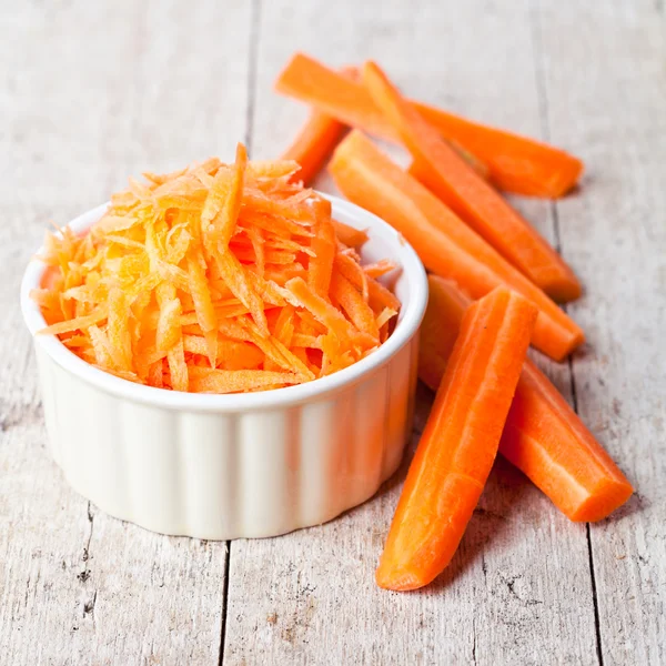 Fresh carrot in white bowl — Stock Photo, Image