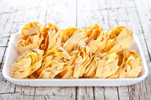 Raw egg pasta in a plate — Stock Photo, Image