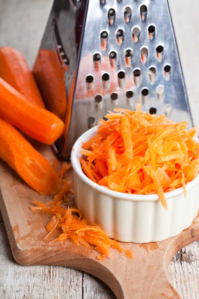 Metal grater and carrot — Stock Photo, Image