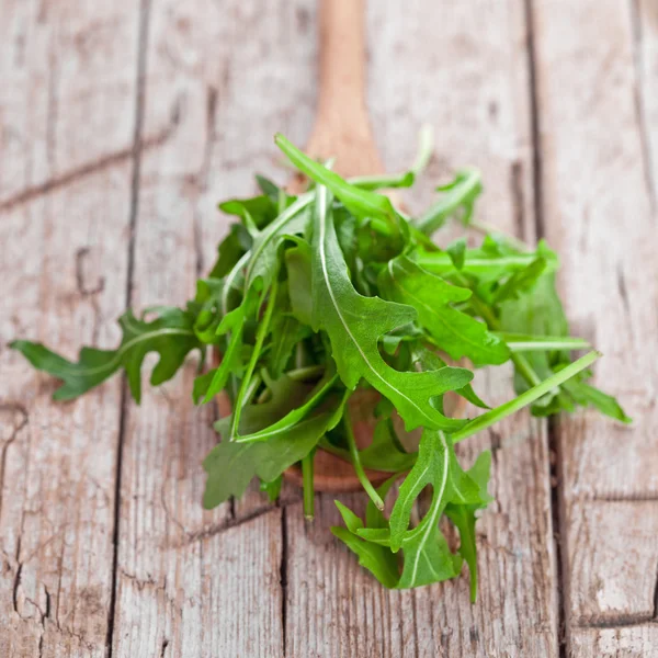 Fresh rucola in a spoon — Stock Photo, Image