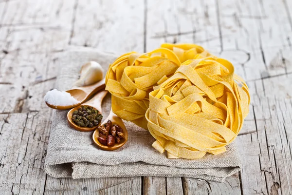 Raw egg pasta and spices — Stock Photo, Image