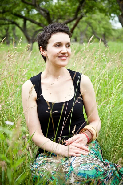 Girl resting on fresh spring grass — Stock Photo, Image