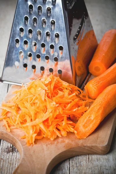 Metal grater and carrot — Stock Photo, Image