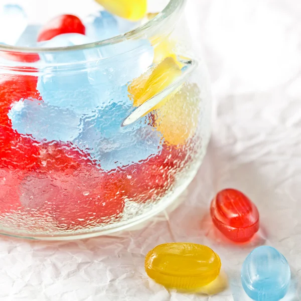 Colorful candies in glass jar — Stock Photo, Image