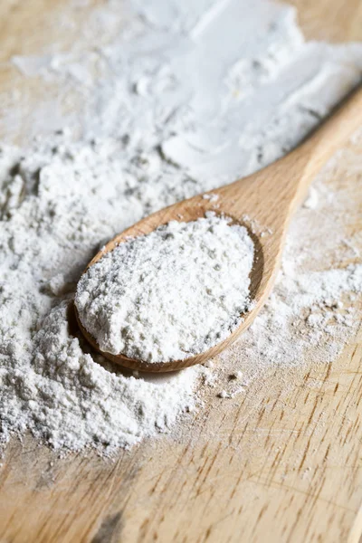Flour in a wooden spoon — Stock Photo, Image