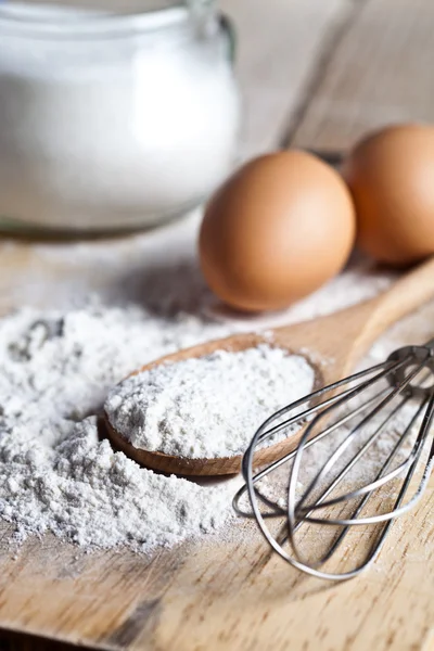 Flour, eggs and kitchen utensil — Stock Photo, Image