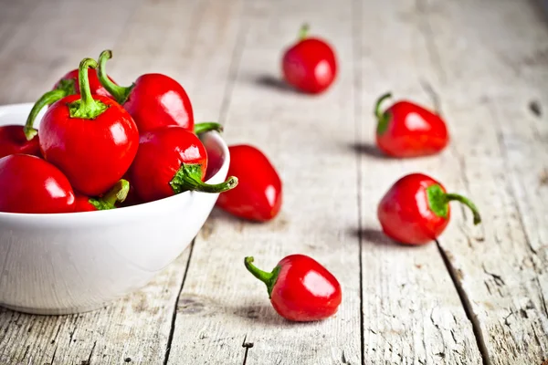Red hot peppers in bowl — Stock Photo, Image