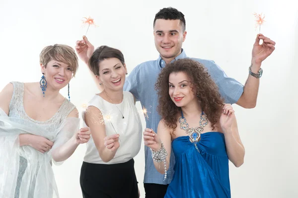 Three girls and the guy on a New Year's holiday — Stock Photo, Image