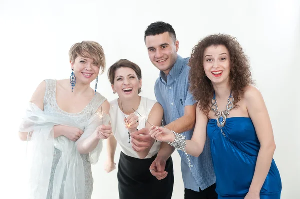 Three girls and the guy on a New Year's holiday — Stock Photo, Image