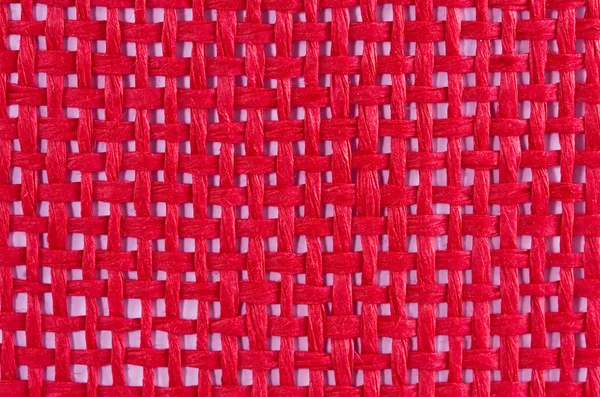 Fundo vermelho com entrelaçamento de tecido — Fotografia de Stock