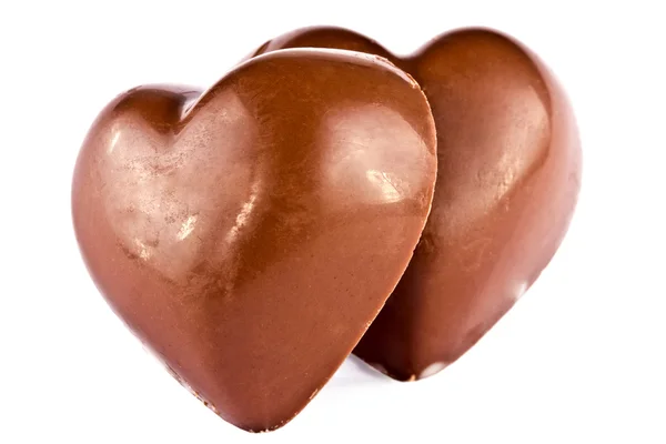 Par de corazones de chocolate cerca aislado — Foto de Stock