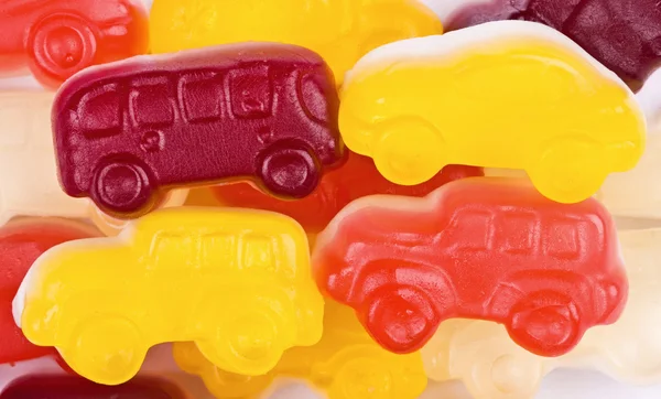 Dulces de frutas coches multicolores, fondo —  Fotos de Stock