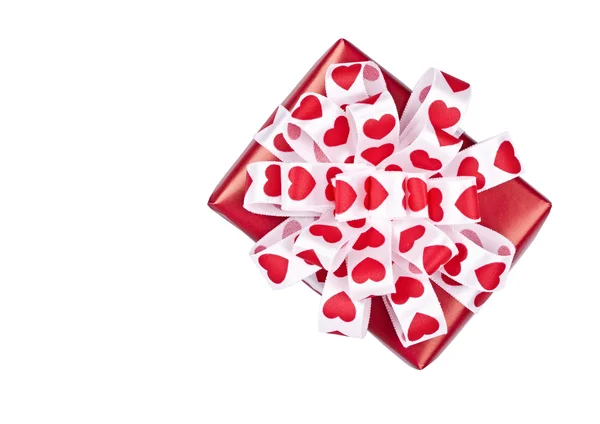 The gift decorated with a tape with hearts — Stock Photo, Image