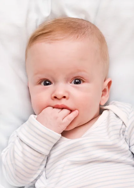 The thoughtful child, hand in a mouth — Stock Photo, Image