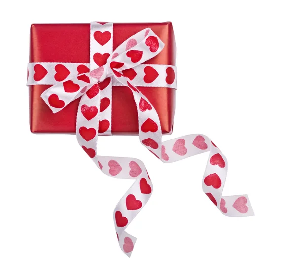 The gift decorated with a tape with hearts on the white — Stock Photo, Image