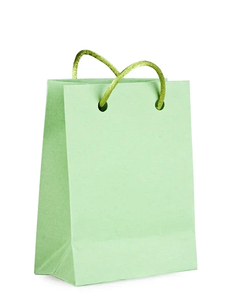 Bolsa verde com compras no branco — Fotografia de Stock