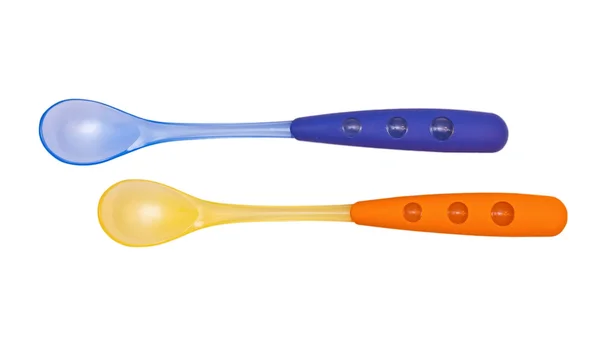 Blue and orange bright children's spoons — Stock Photo, Image