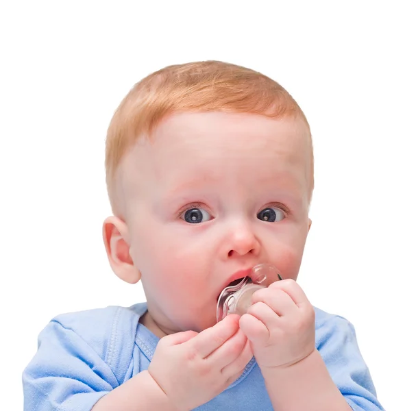 The emotional child with a baby's dummy in hands on the white — Stock Photo, Image