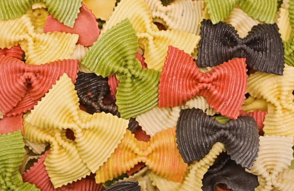 Multi-colored pasta in the form of bows — 图库照片