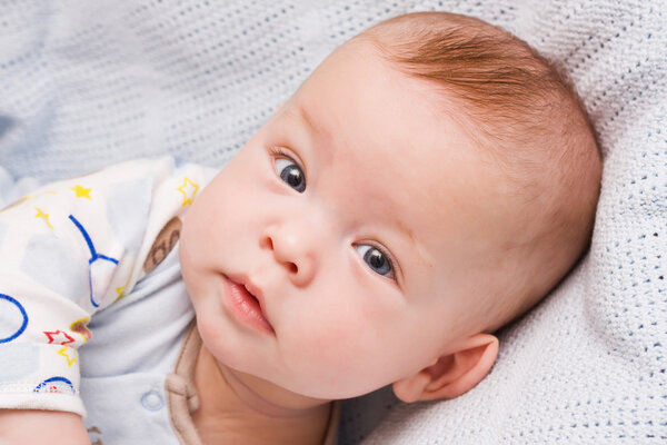 Attentive sight of the six-month-old child, close up