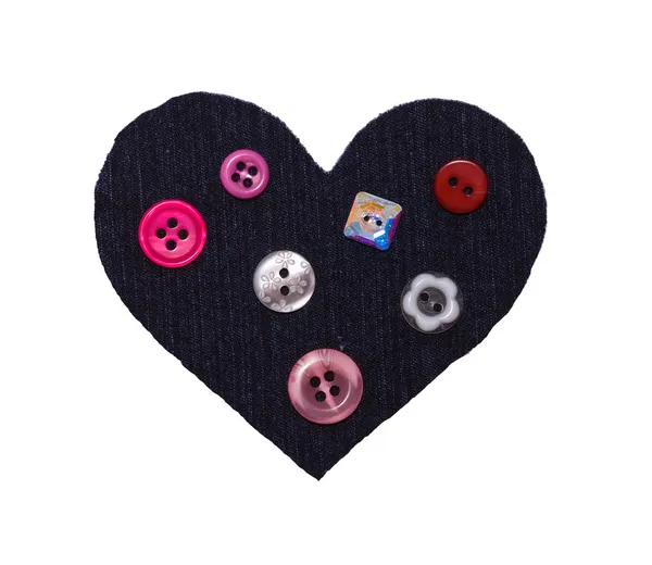 Coração de um tecido e botões em branco o isolado — Fotografia de Stock