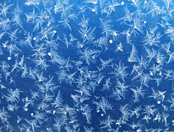 Frosty patroon op blauw — Stockfoto