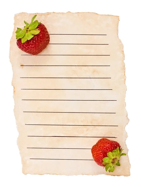 Старая бумага и ягоды — стоковое фото
