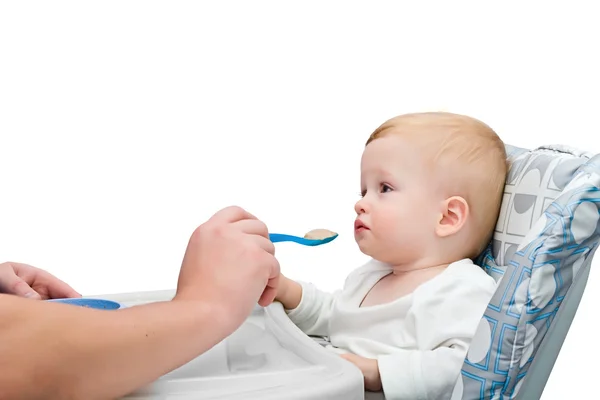 The one-year-old kid eats porridge — Stock Photo, Image