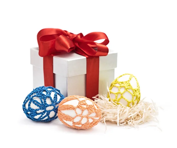 Easter eggs and gift in a box with a bow — Stock Photo, Image