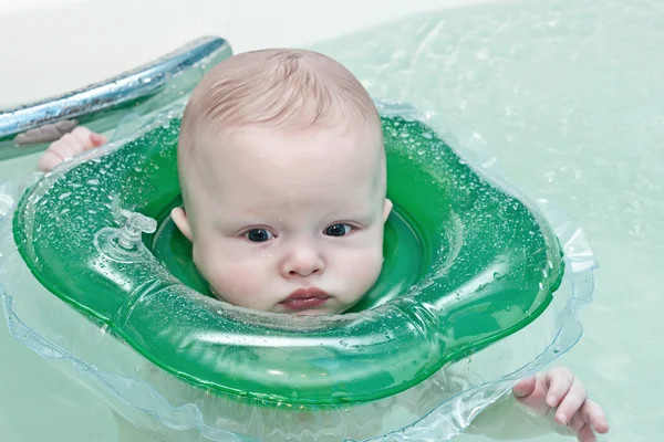 Swimming child in a bathroom — Stock Photo, Image