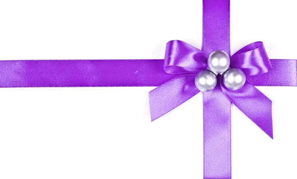 Lilac bow and silver spheres — Stock Photo, Image