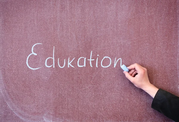 Word education written on the blackboard with chalk. — Stock Photo, Image