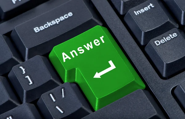 Large green computer keyboard button with the word answer and ar — Stock Photo, Image