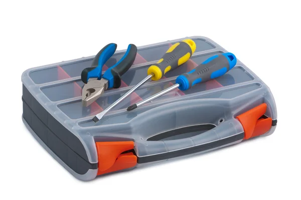 Destornillador y alicates en una caja de herramientas de plástico sobre fondo blanco —  Fotos de Stock