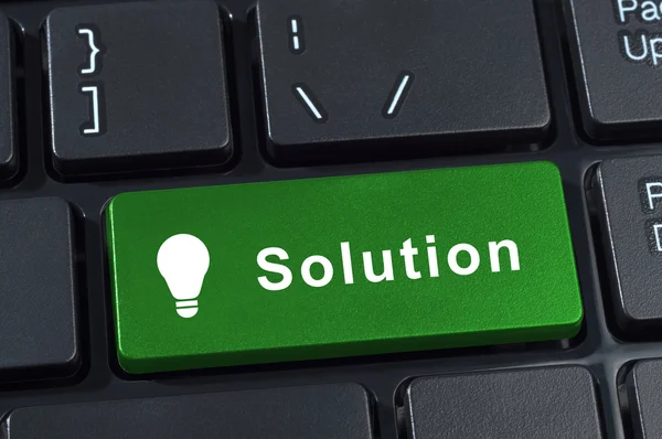 Solutions button computer keyboard with icon lightbulb. — Stock Photo, Image