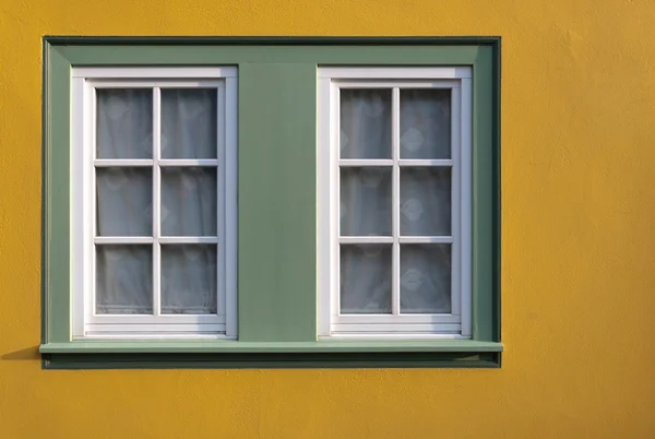 Window on yellow wall of the house. — Stock Photo, Image