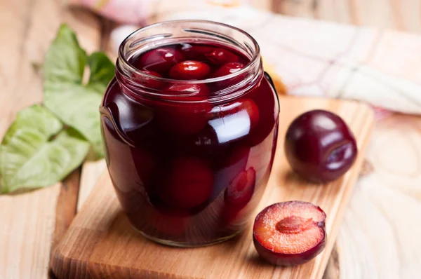 Canned Plums Glass Jar Closeup Wooden Table — Stock Photo, Image