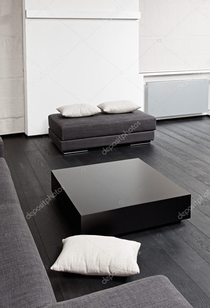 Part of modern sitting room interior in black and white tones