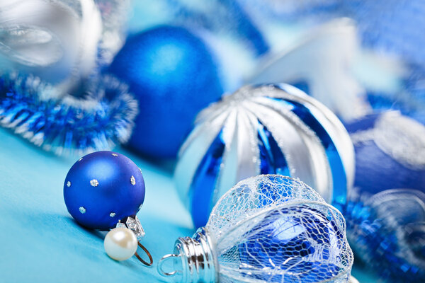 New Year decorations ball on blue blurred background
