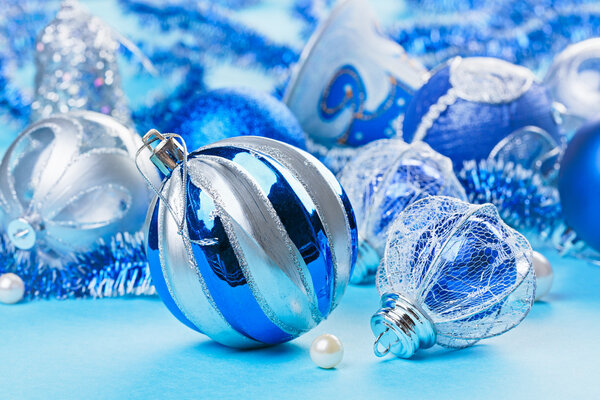 Christmas decoration balls on blue background, closeup