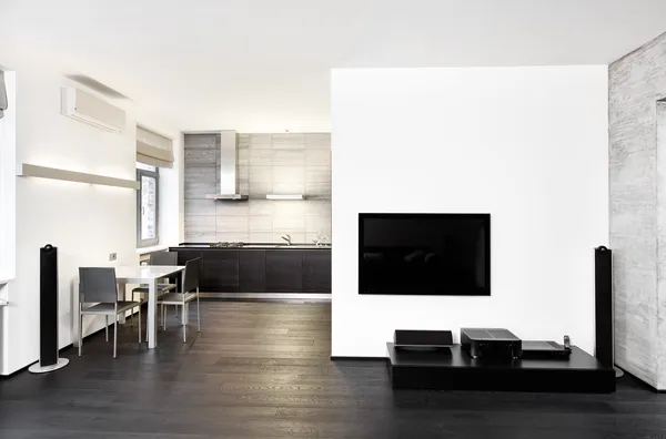 Moderne minimalisme stijl keuken en salon interieur in zwart-wit tonen Stockafbeelding
