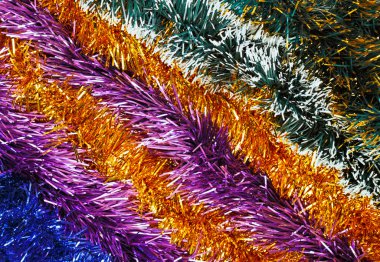 Christmas tinsel multicolored decoration laid diagonally clipart