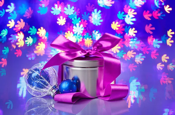 New Year composition with fancy box on snowflake shaped bokeh ba — Stock Photo, Image