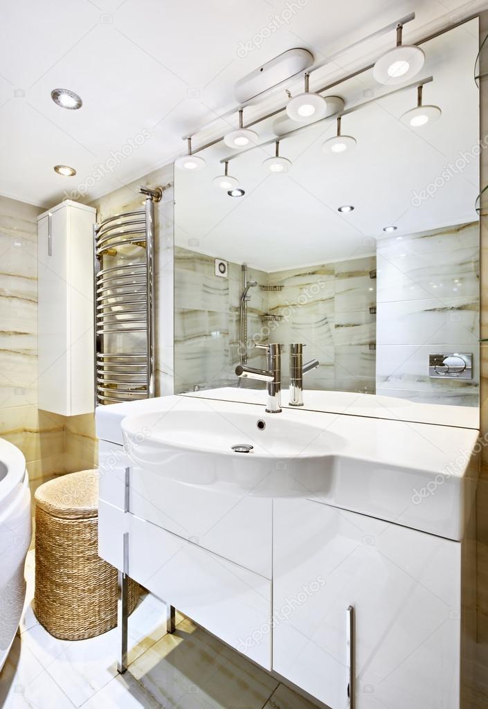 Wash stand with mirror in modern white bathroom interior