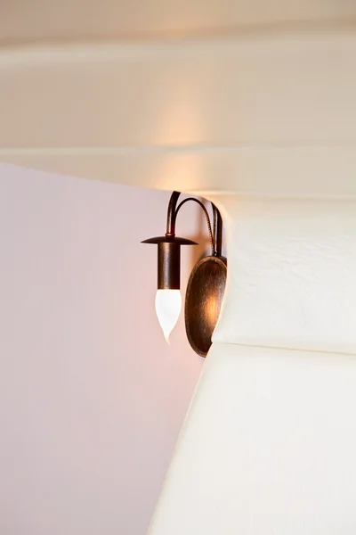 Unusual lather headboard and lamp, interior detail — Stock Photo, Image